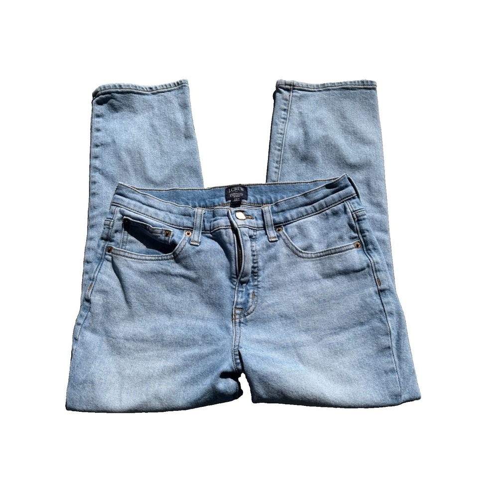 J.Crew Essential Straight jeans feature a light wash and are labeled as size 28P